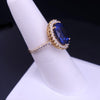 Regal Oval Sapphire Diamond Halo Statement Ring