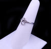 Elegant Diamond Bypass Ring with Dual Round Stones