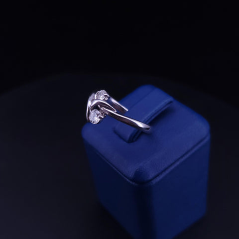 Elegant Diamond Bypass Ring with Dual Round Stones