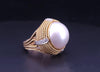 Cassis white pearl and diamond cocktail ring set in 18k yellow gold.