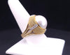 Cassis white pearl and diamond cocktail ring set in 18k yellow gold.