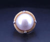 Cassis white pearl and diamond cocktail ring set in 18k yellow gold.